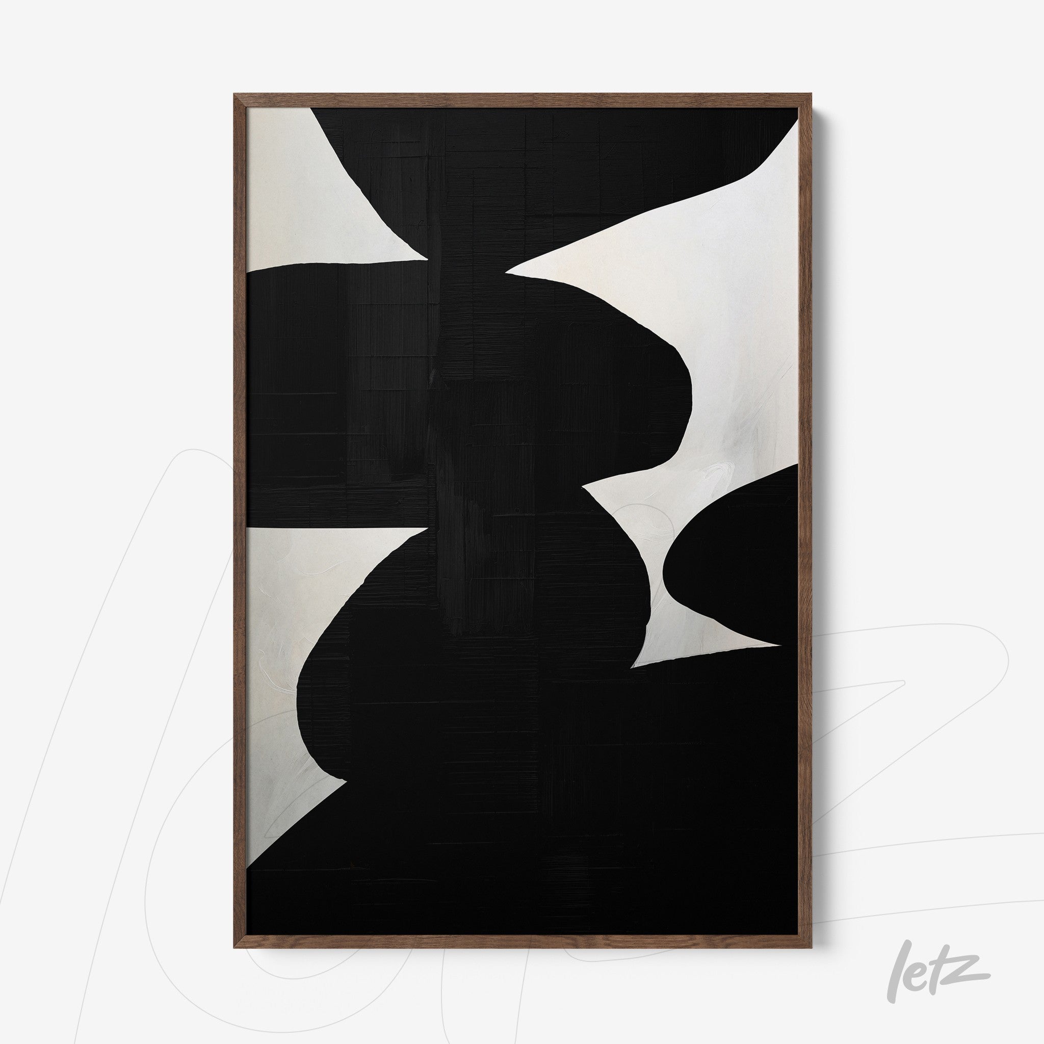 modern framed art featuring abstract black and white design with light wood frame
