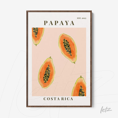 framed art featuring illustrations of papaya slices on pink background with dark wood frame and stylized text