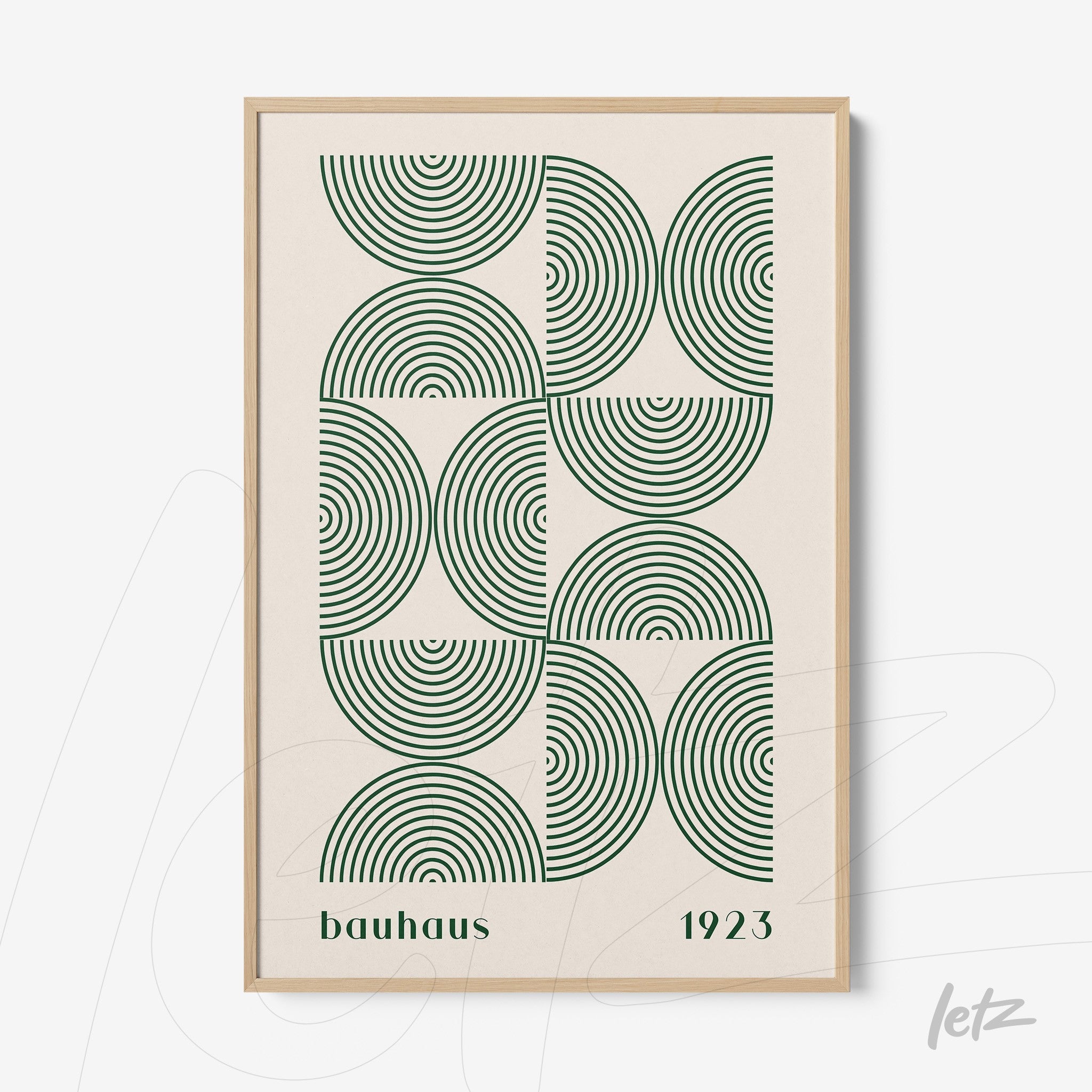 framed wall art with geometric Bauhaus-style pattern featuring green circles and light wooden frame