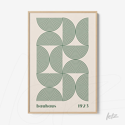 framed wall art with geometric Bauhaus-style pattern featuring green circles and light wooden frame