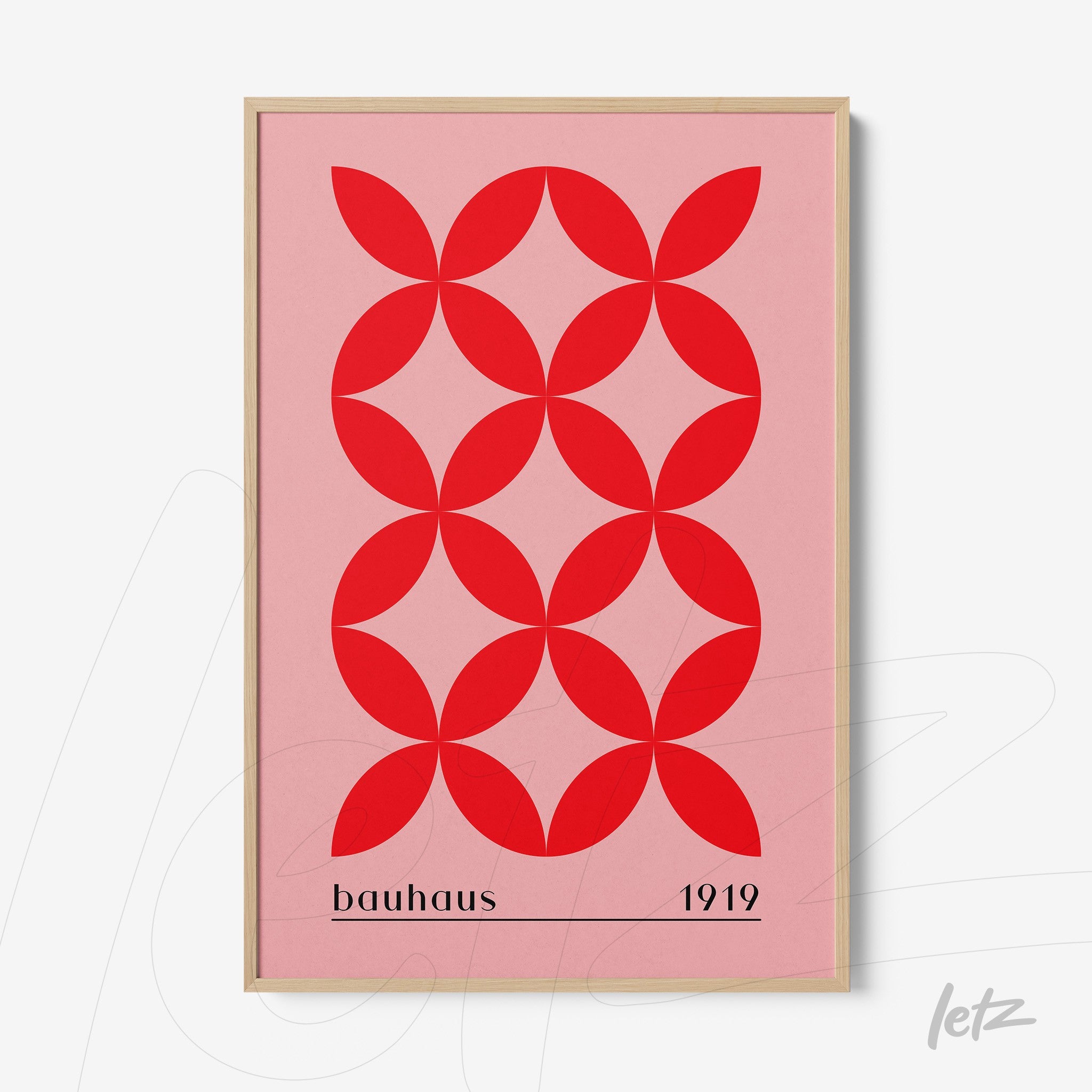 poster with red geometric pattern on pink background and 'bauhaus 1919' text in light frame