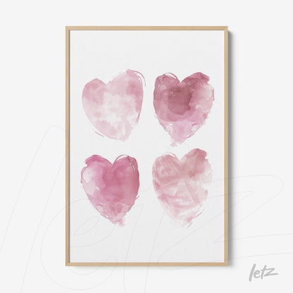 framed art with four pink watercolor hearts in light wooden frame