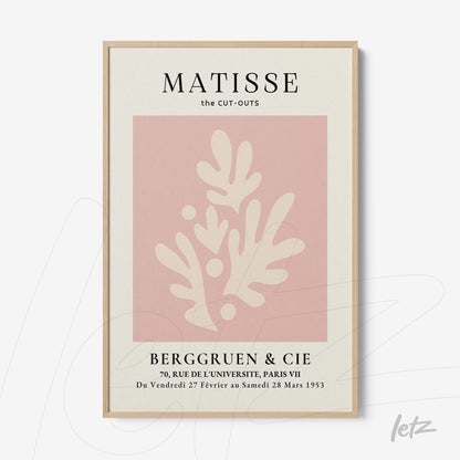 framed wall art featuring abstract shapes in pink and cream with light frame, showcasing organic forms and black text