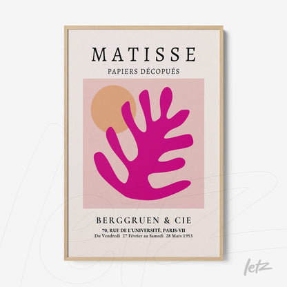 framed abstract artwork featuring pink leaf shapes on a light background with a light wood frame