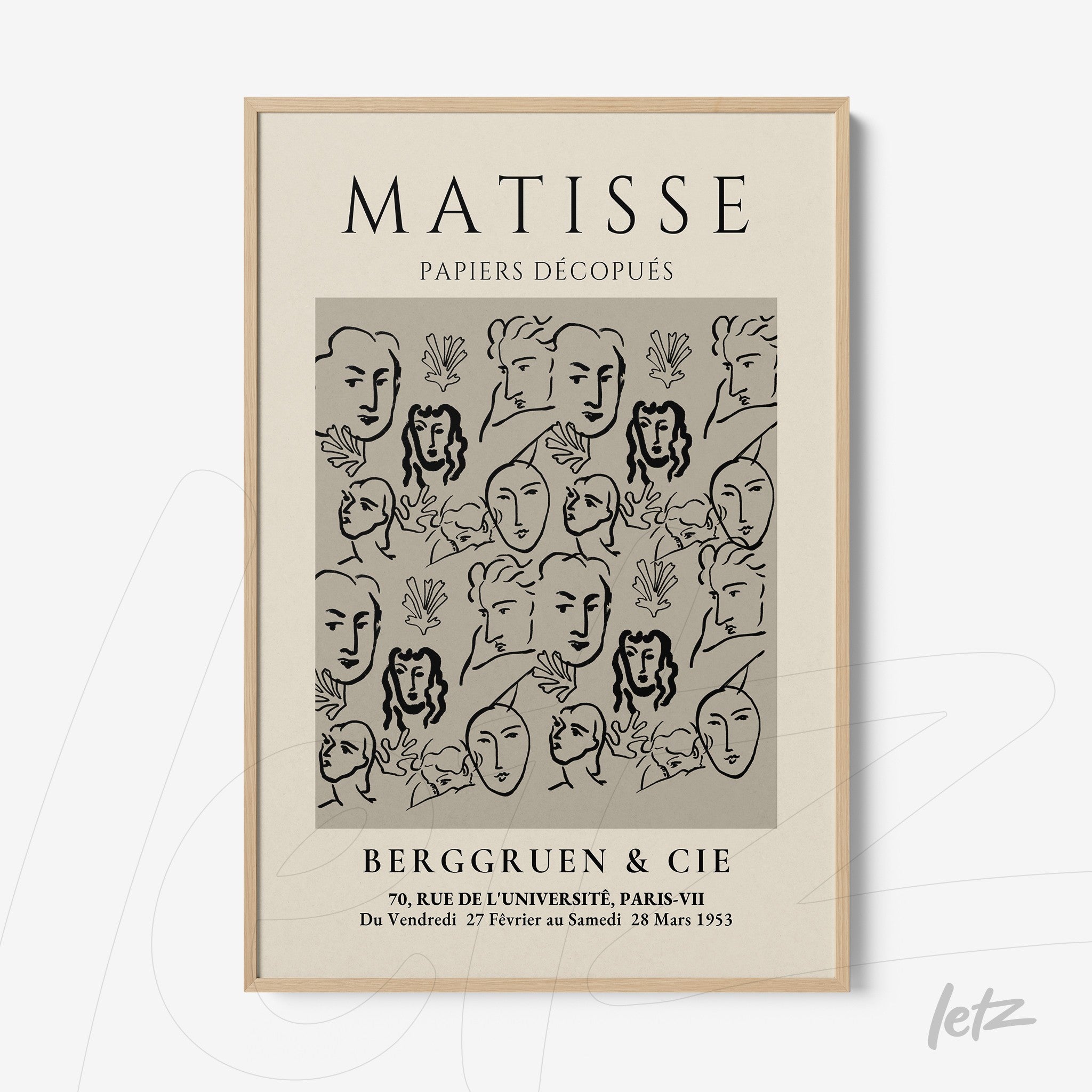 wall art featuring modern style illustration of faces and leaves on gray background in light frame