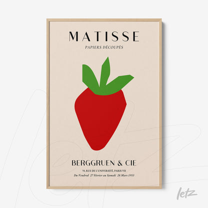 framed modern art depicting a stylized strawberry with a light wood frame
