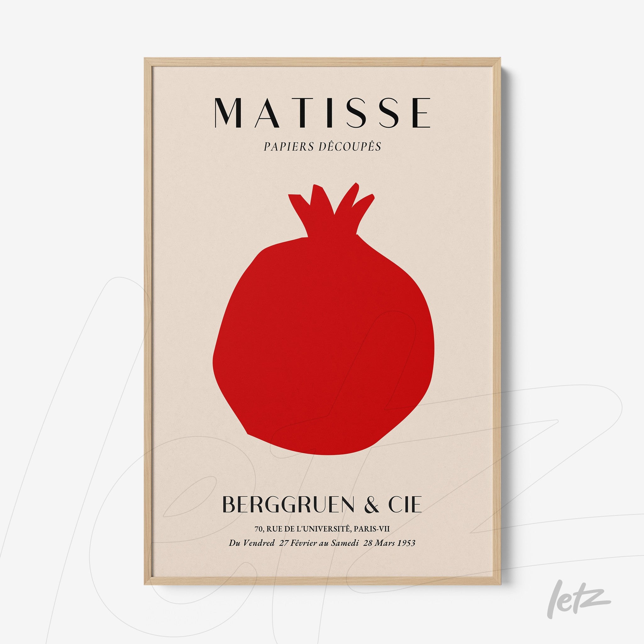 abstract wall art featuring a red pomegranate on cream background with light wood frame