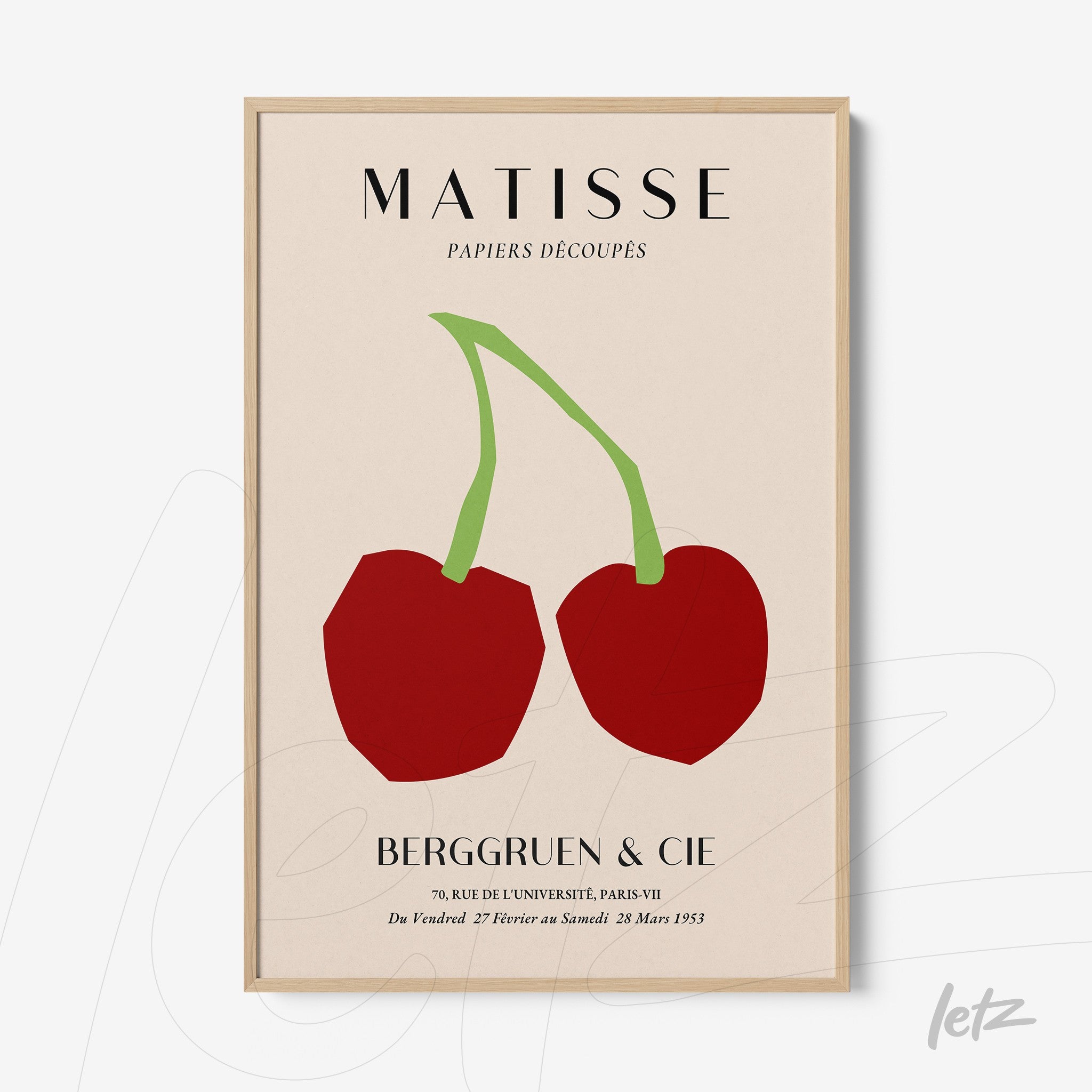 framed wall art featuring modern illustration of two red cherries on a light background with a light wood frame