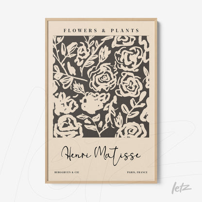 abstract floral wall art framed in light wood with a cream background