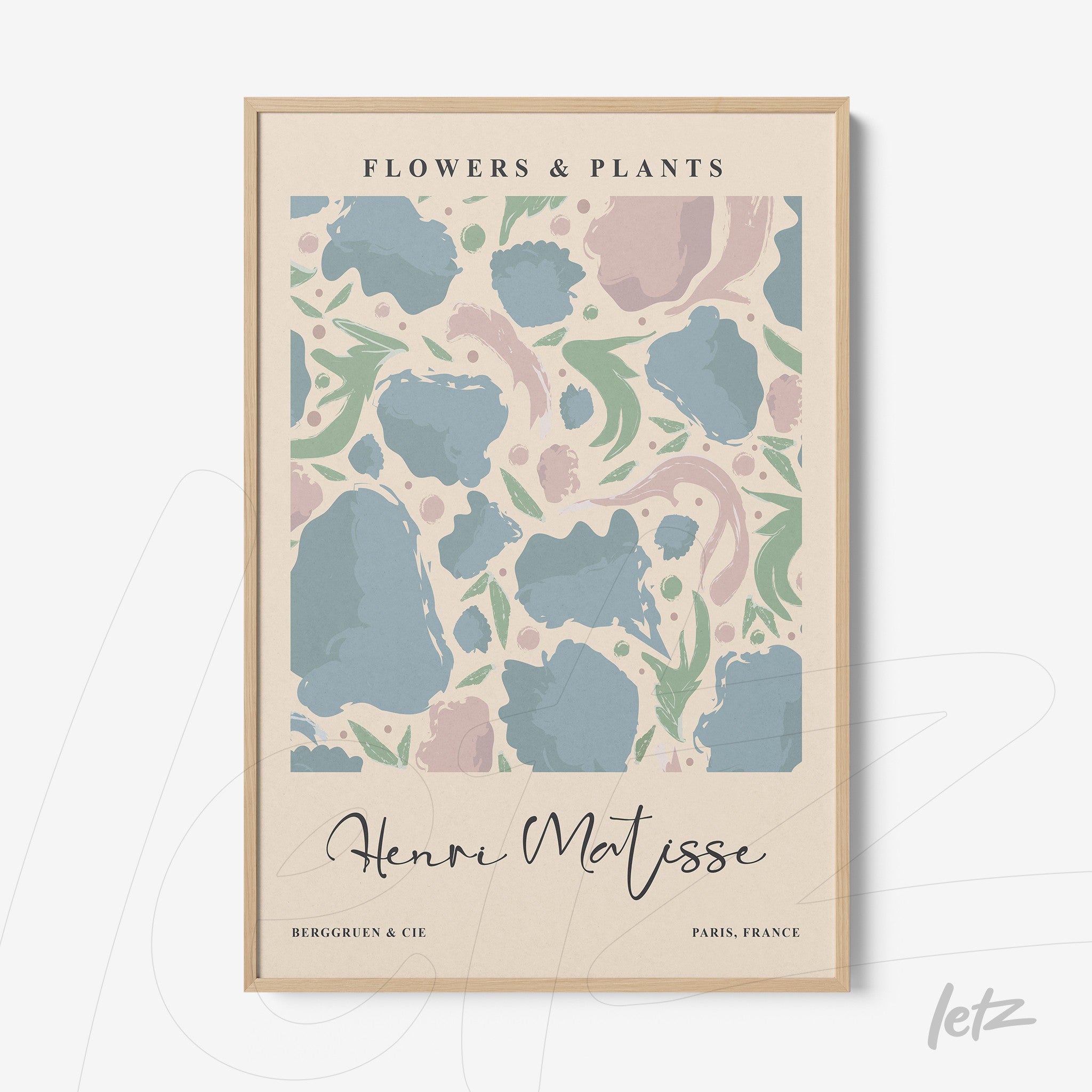 framed modern art featuring pastel flowers and leaves on a light background with light wood frame