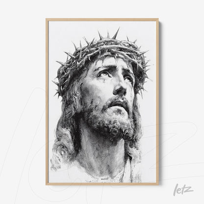framed artwork with light wood trim featuring a black and white portrait of Jesus wearing a crown of thorns