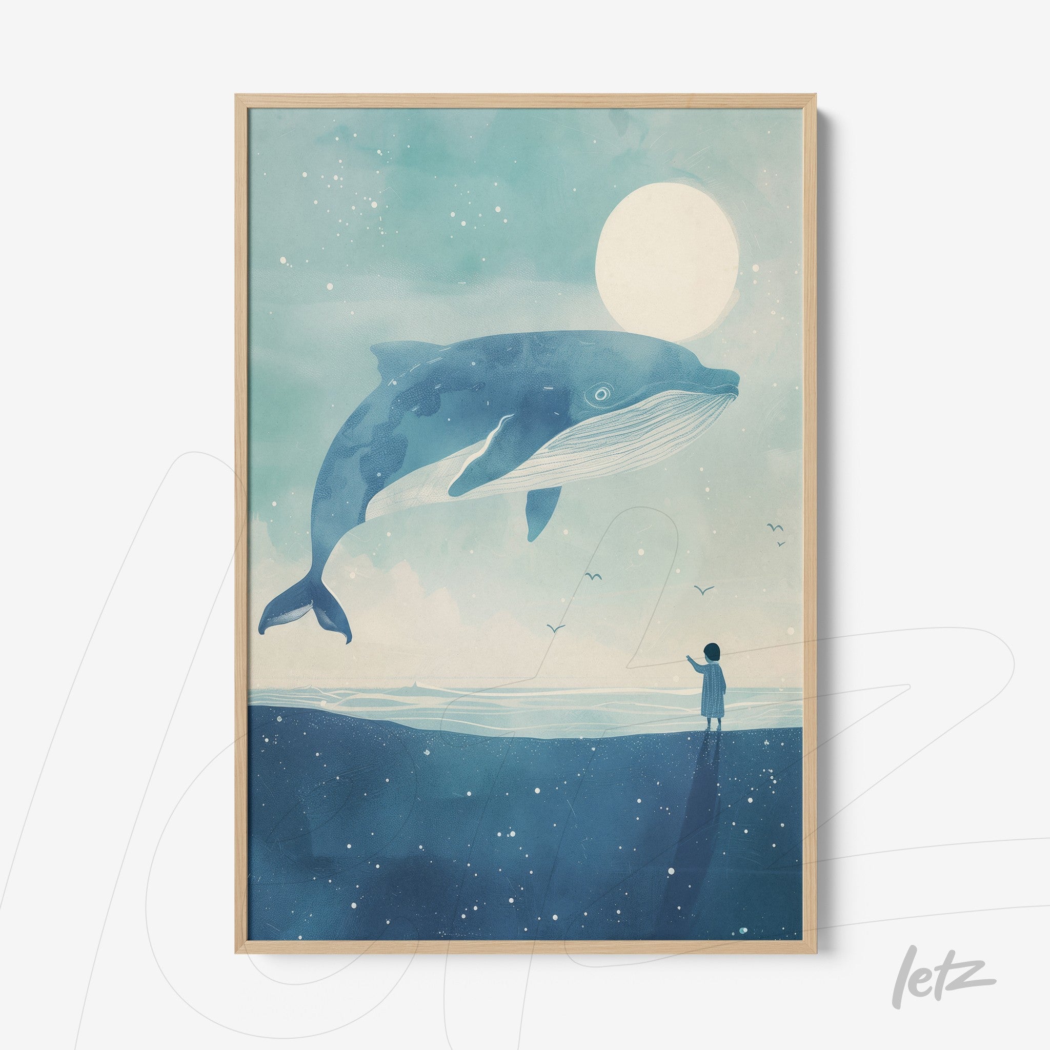 framed wall art featuring a giant whale over the ocean with a human figure watching, set in a light wood frame