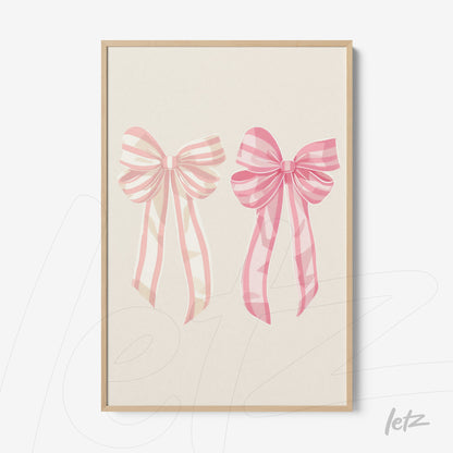 framed art featuring pink bow illustrations with a light wood frame