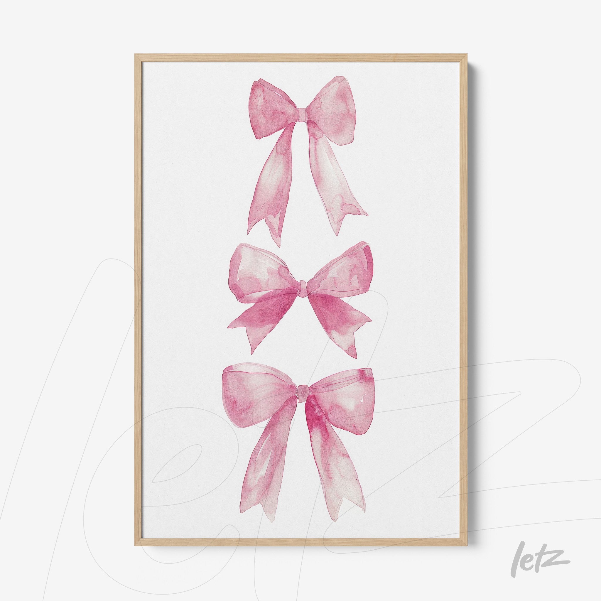 framed wall art featuring watercolor pink bows in a light wooden frame