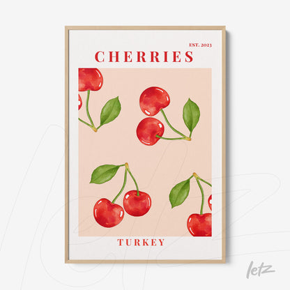 framed wall art featuring cherry illustrations on light pink background with light wood frame