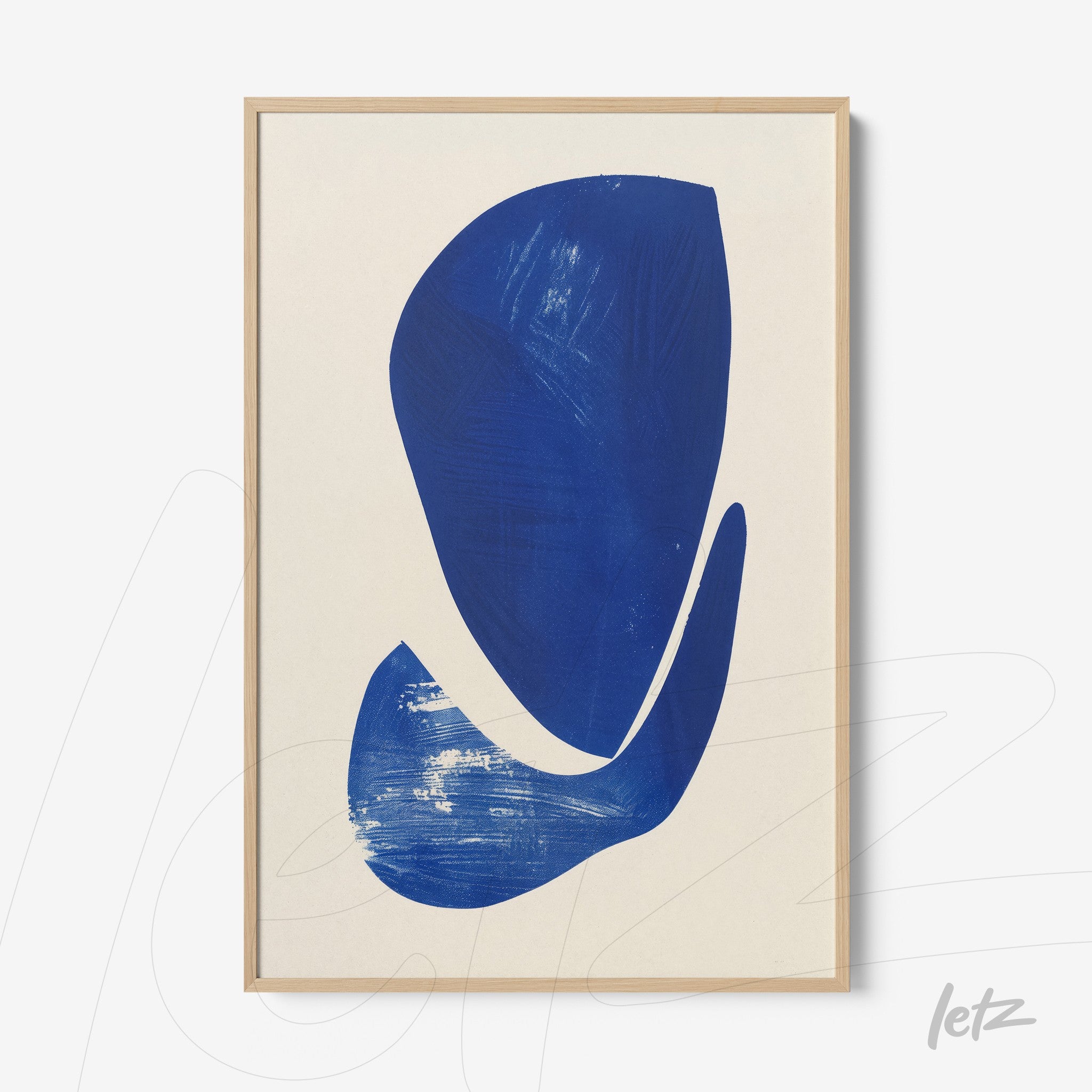 abstract art piece in blue tones framed in light wood