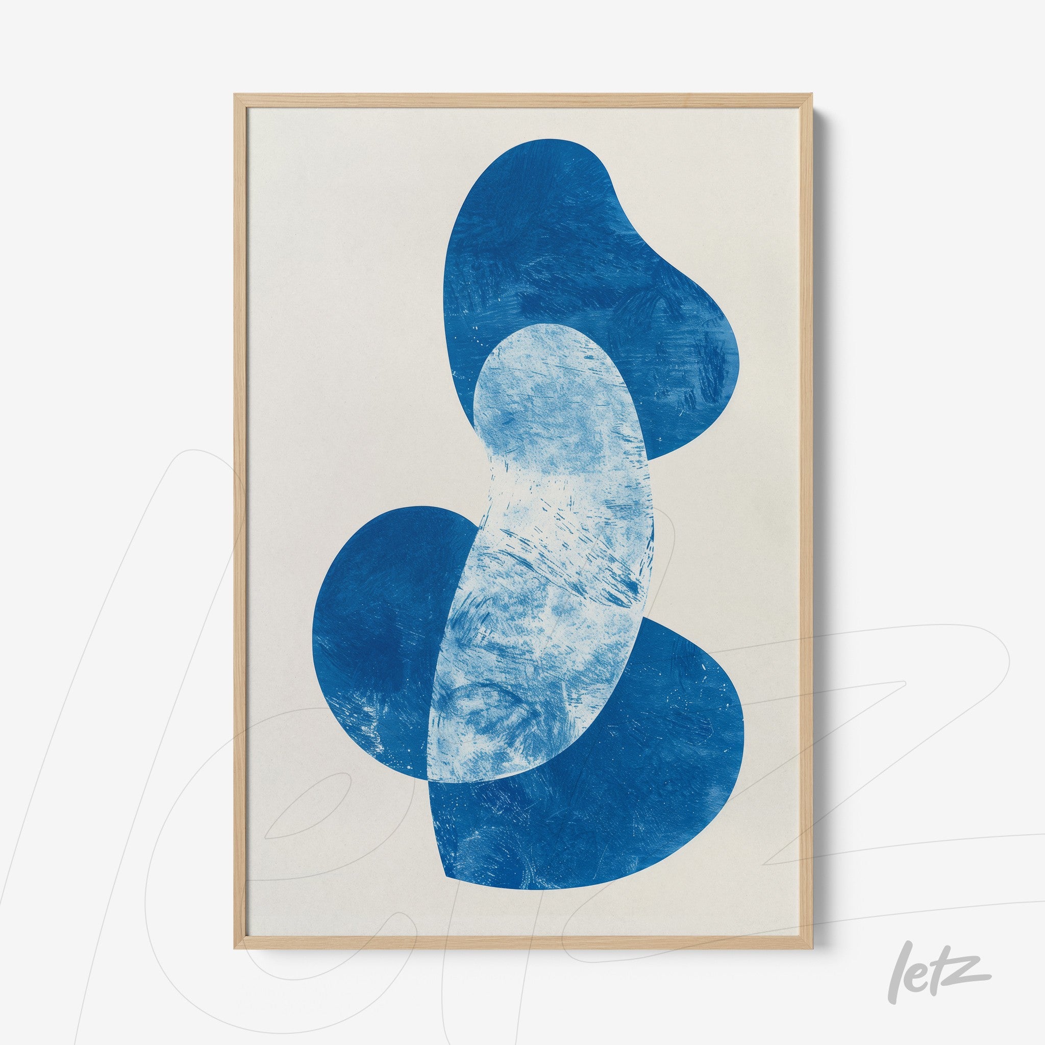 framed artwork with abstract blue shapes on light background