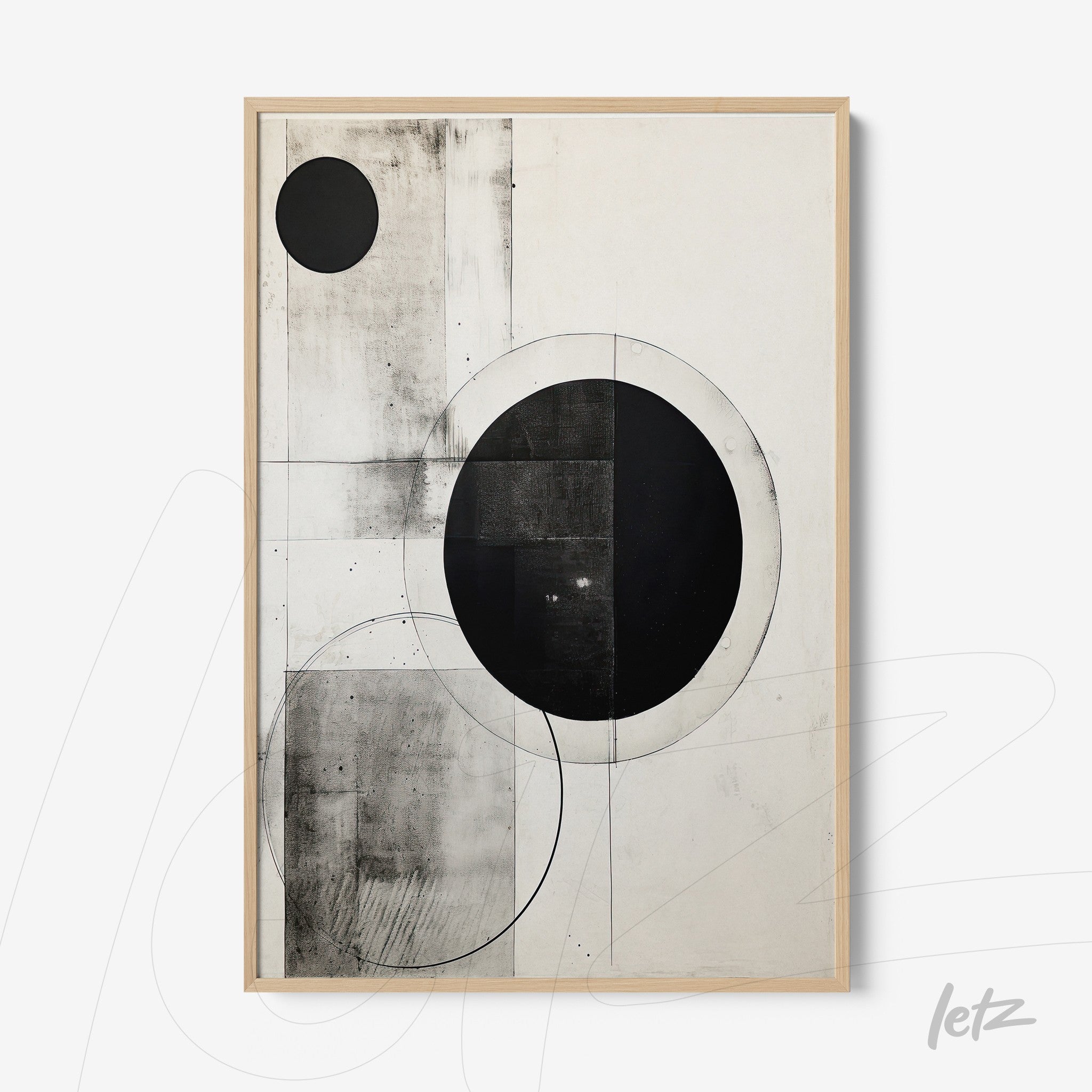 abstract wall art in black and white featuring geometric shapes, circles and straight lines, framed with light wood