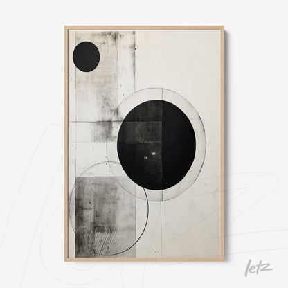 abstract wall art in black and white featuring geometric shapes, circles and straight lines, framed with light wood