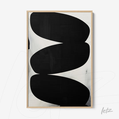 abstract wall art in black and white featuring organic shapes in light wood frame