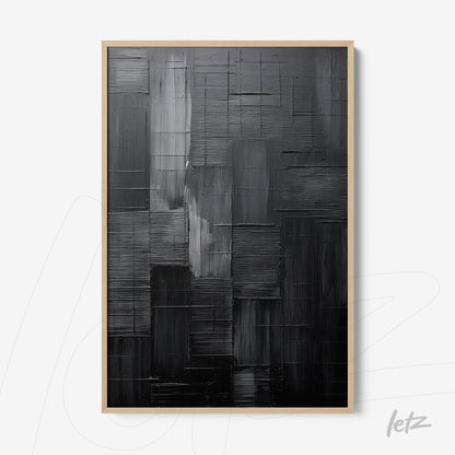 modern wall art featuring an abstract textured design in black tones with light wood frame