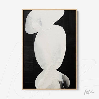 framed abstract art piece with overlapping white shapes on black background and light wood frame