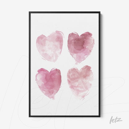 framed artwork featuring four watercolor hearts in shades of pink
