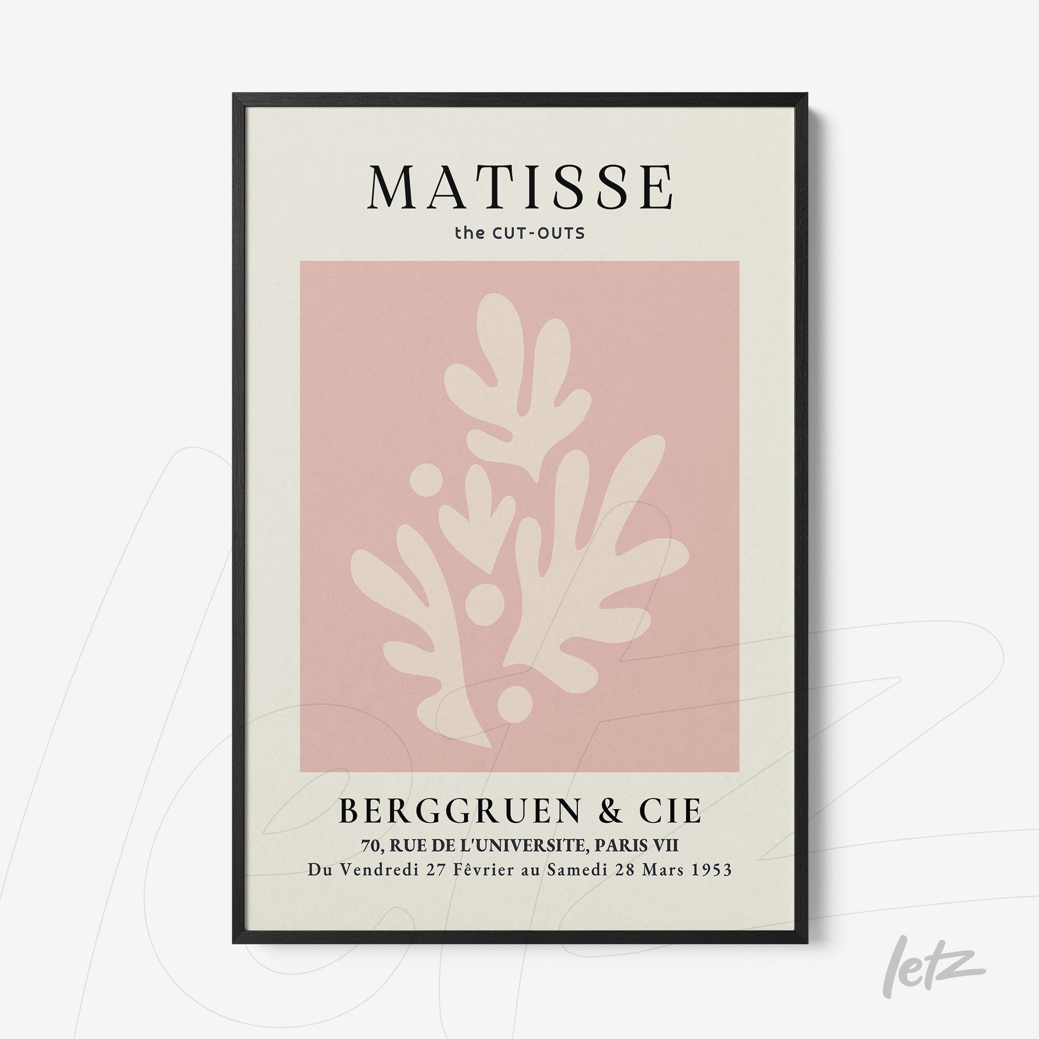 framed art with abstract shapes in shades of pink and cream with a thin black frame
