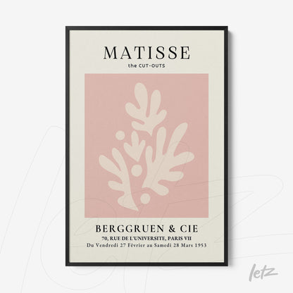 framed art with abstract shapes in shades of pink and cream with a thin black frame