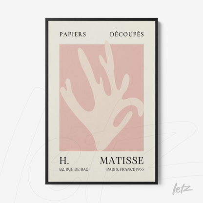 framed wall art featuring a modern minimalistic design of a hand on a pink background
