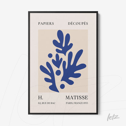 framed art with abstract blue leaves on light background with black frame