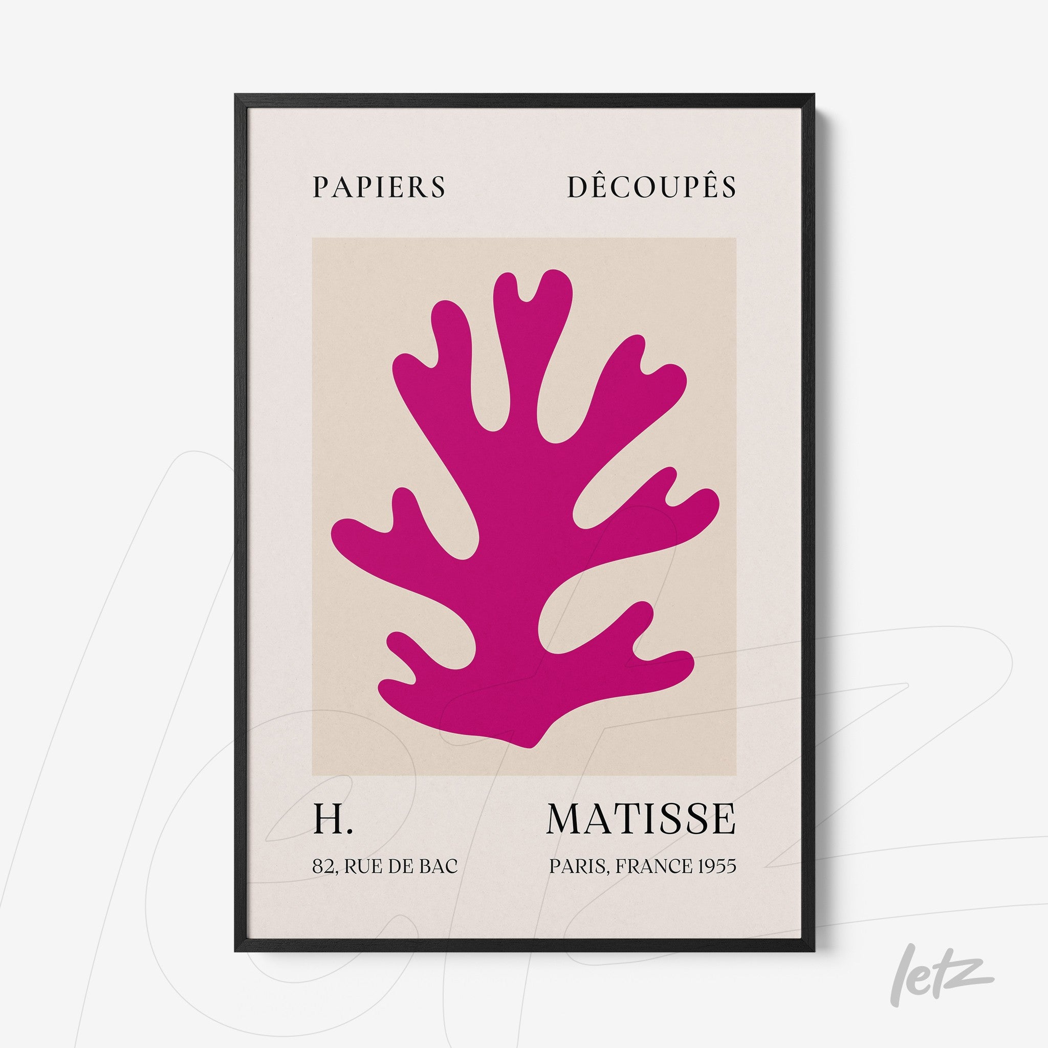 framed wall art featuring a modern abstract design of a vibrant pink coral shape with a thin black frame and neutral background