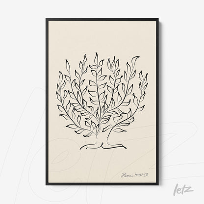 framed wall art featuring a line drawing of leaves in a black frame on a light background