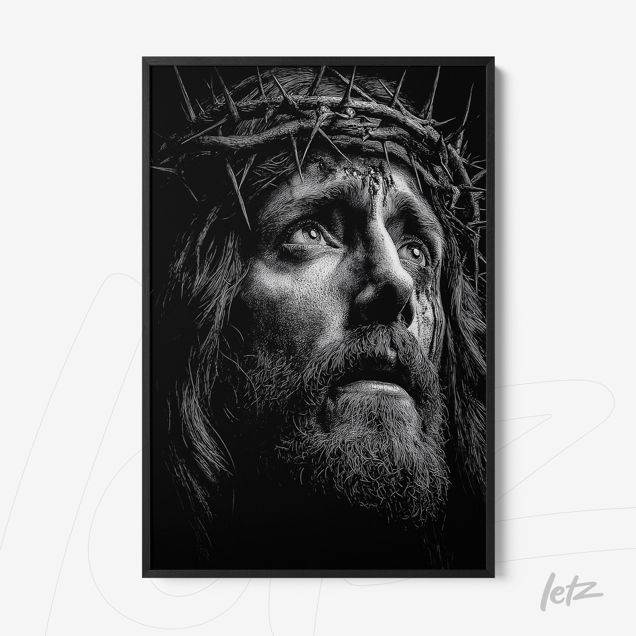 black and white framed art depicting a portrait of Jesus Christ wearing a crown of thorns