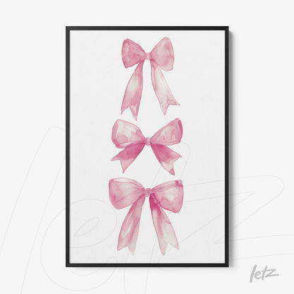 framed artwork featuring watercolor illustrations of pink bows with a black frame