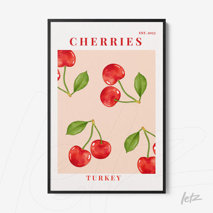 framed artwork featuring red cherries on a light pink background with black frame and bold red text