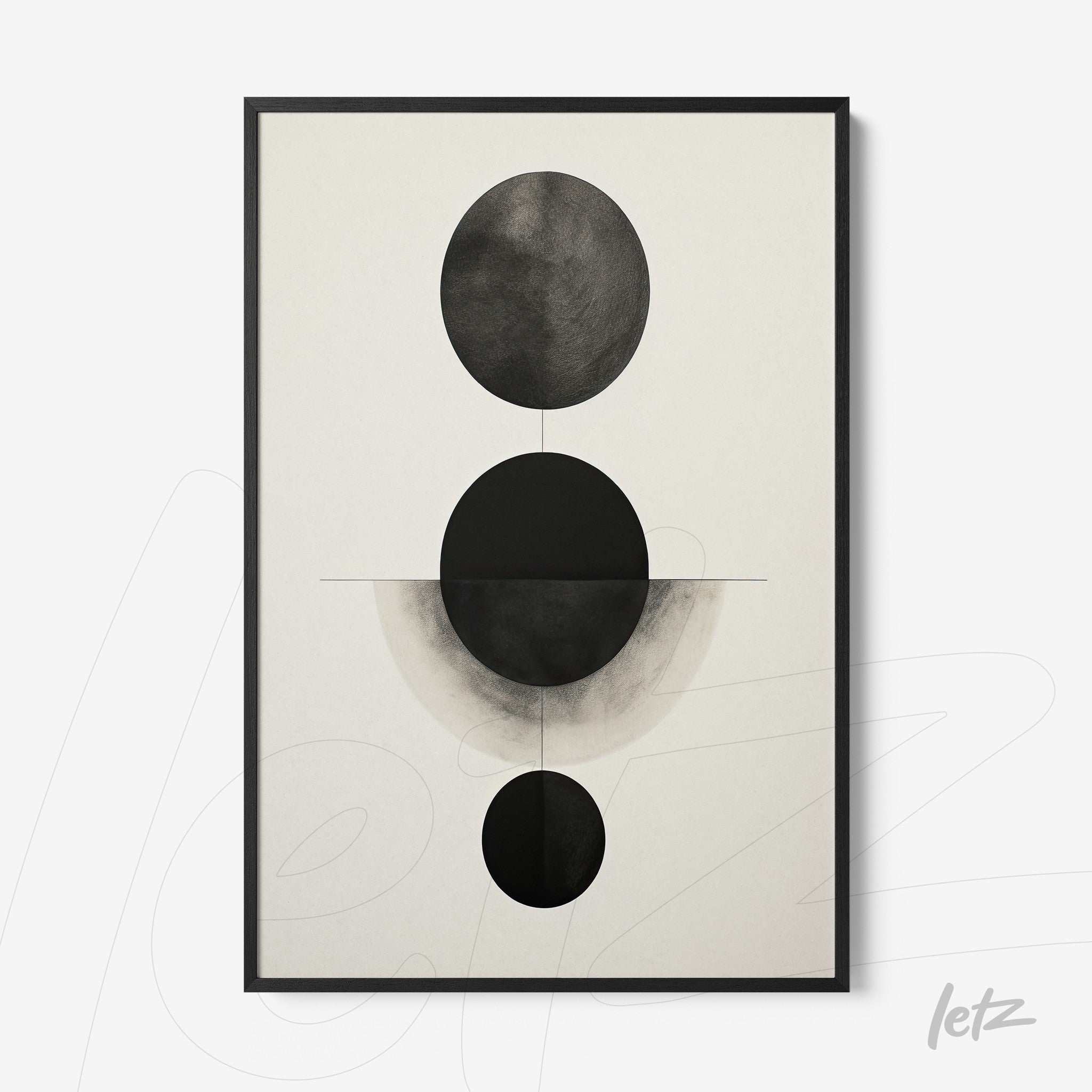 abstract wall art featuring black and white geometric circles on light background with black frame