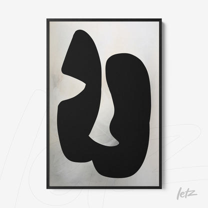 abstract wall art with black shapes on light background in black frame