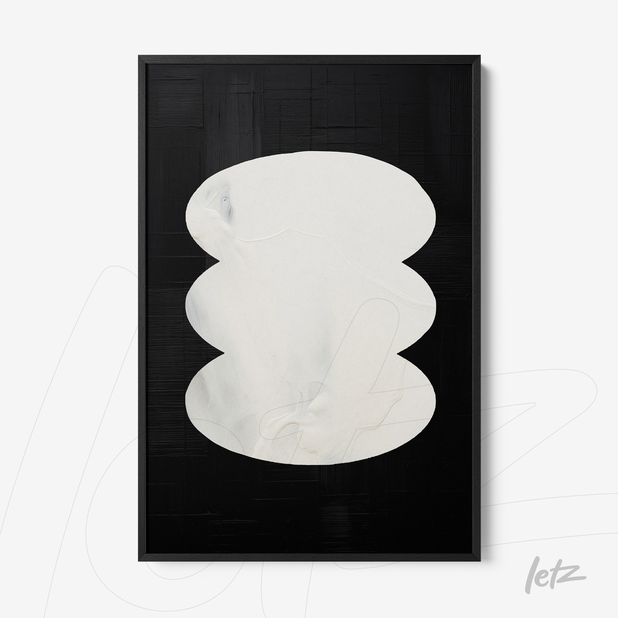abstract wall art featuring soft white shapes on a black background with a black frame