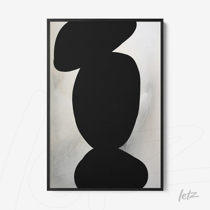 abstract wall art featuring black shapes on light background in black frame