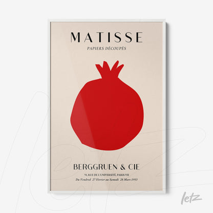 framed modern art piece featuring a red pomegranate silhouette against a light background
