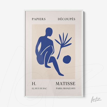 framed cut paper art in modern style featuring a blue figure and natural elements with white frame