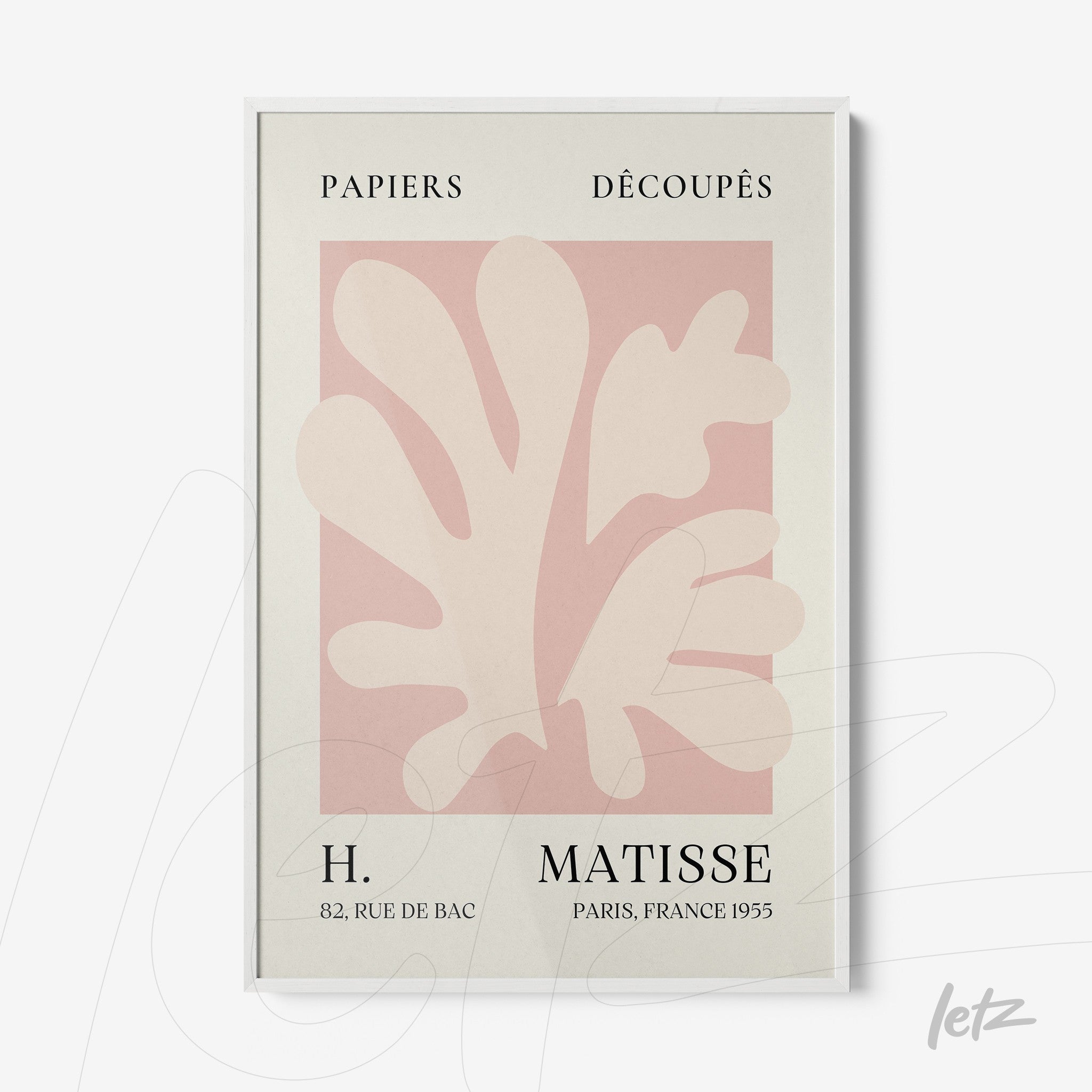 framed wall art featuring abstract leaf shapes in soft tones with vintage text and white frame