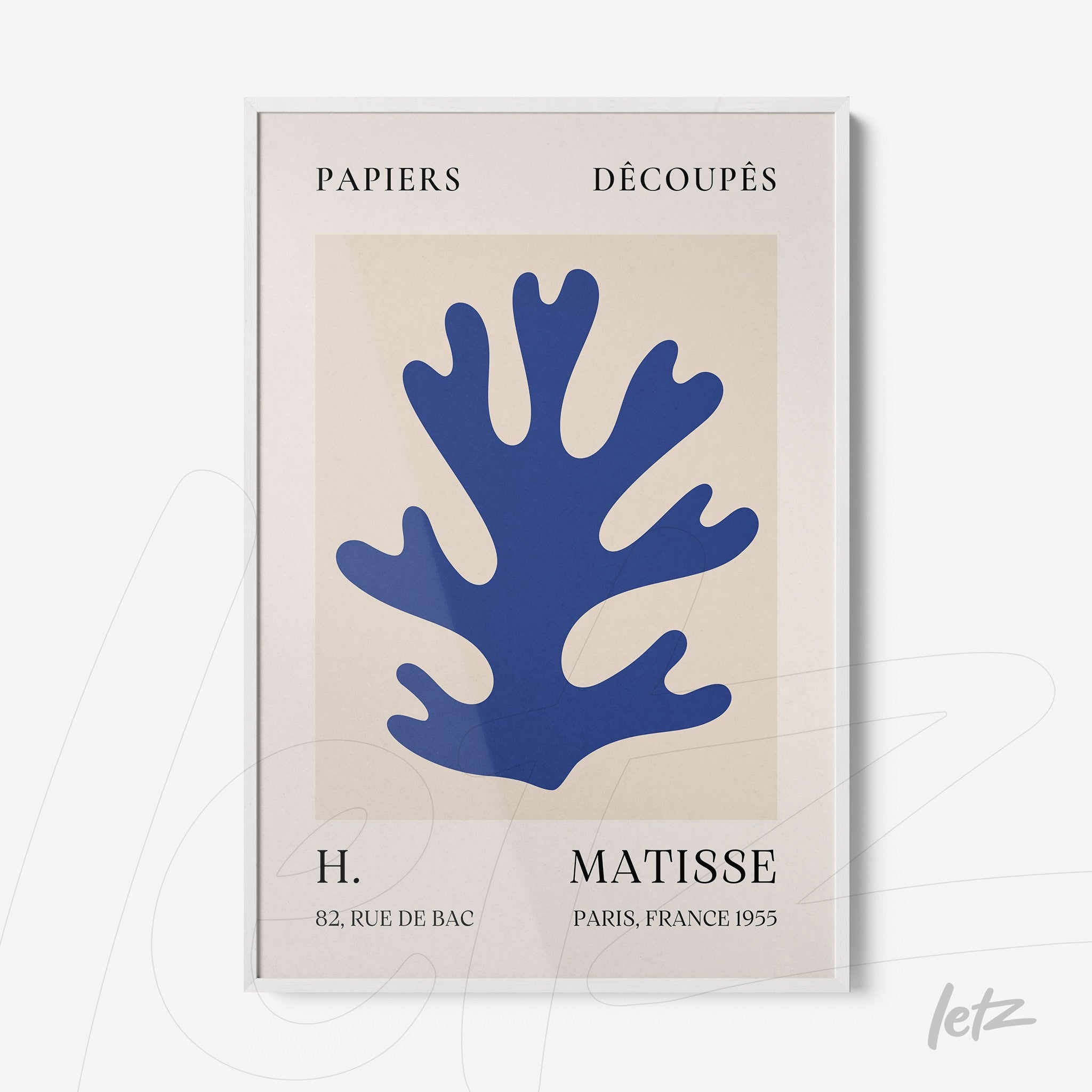 framed modern art piece featuring blue coral shape on a light background with white borders