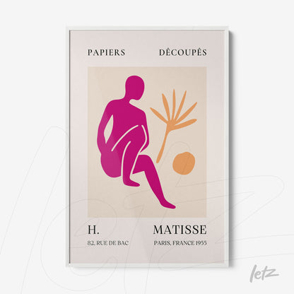 framed modern art piece featuring a vibrant colored sitting figure next to a plant in a white frame