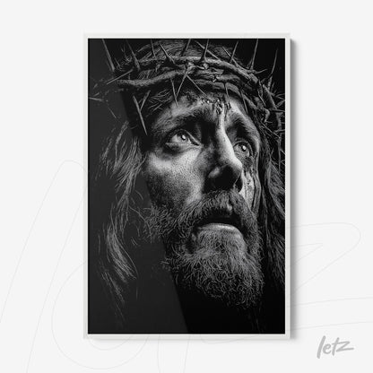 black and white framed wall art depicting the face of Jesus with a crown of thorns in white frame