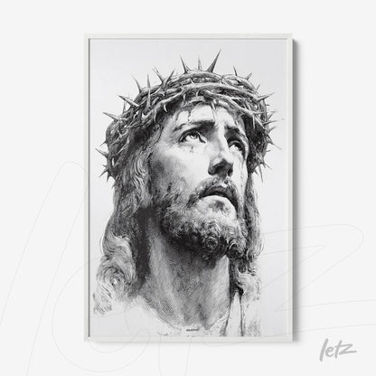 framed black and white portrait of Jesus Christ with a crown of thorns in white frame