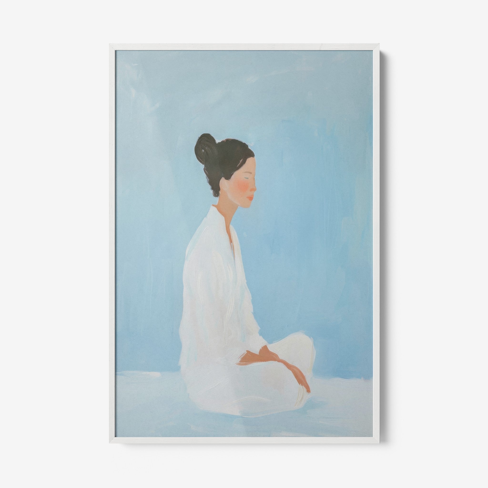 framed artwork of a woman meditating against a light blue background