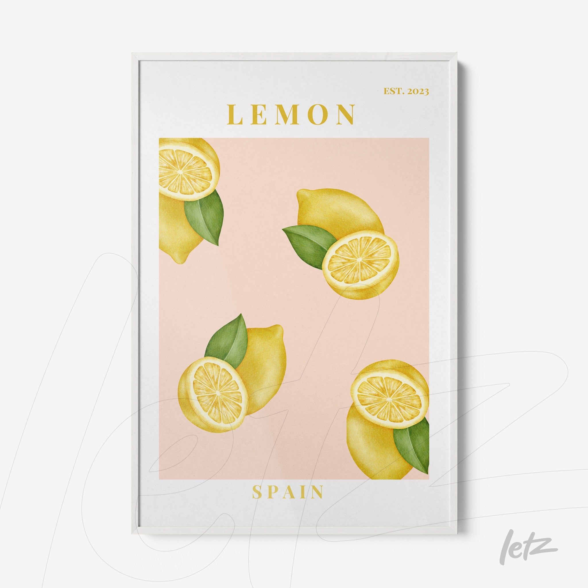 framed art featuring lemons on a pink background with white frame and golden text