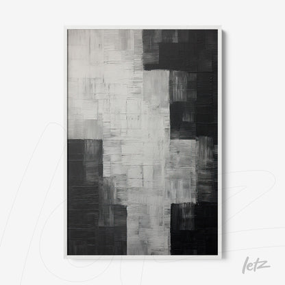 abstract wall art in black and white with layered textures, framed in white